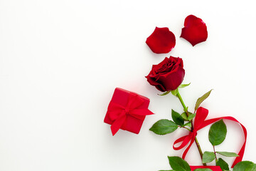 Valentine's Day. Red rose with a ribbon, love letter and red box.