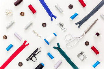 Sewing accessories and sewing supplies. Spools of thread, scissors and centimeter
