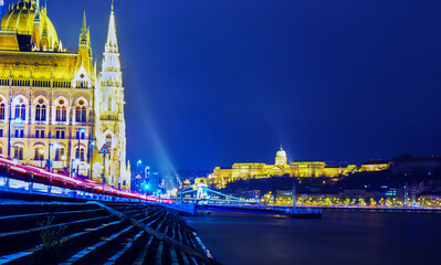 Fototapeta na wymiar Amazing Building of Hungarian parliament and Royal palace of Buda on other side of river Danube - night scene
