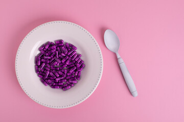 Plate filled with pills, addiction and drug abuse problem 