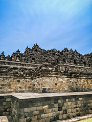Fototapeta na wymiar Borobudur temple from the side with a clear sky Magelang, Indonesia