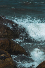 waves crashing on rocks