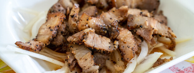 Delicious Taiwanese salted pork food with onion in restaurant.