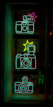 Neon light cameras, shop display, London, England 