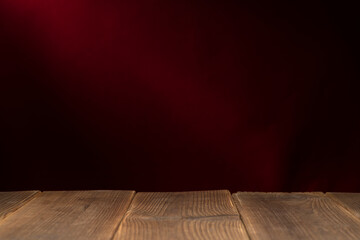 Wooden board empty table in front of a blurred background. Perspective brown wood with a blurry multi-colored background - can be used to showcase or assemble your products. Mock up