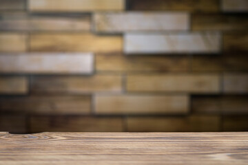 Wooden board empty table in front of blurred background. Perspective brown wood with brick background - can be used to display or assemble your products. Mock up