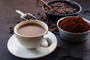 Obraz na płótnie Canvas .Roasted coffee beans with coffee powder and coffee cups.