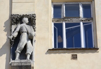 Obraz premium Sculptures of agricultural workers on the building of the Agricultural Society. Krakow. Poland