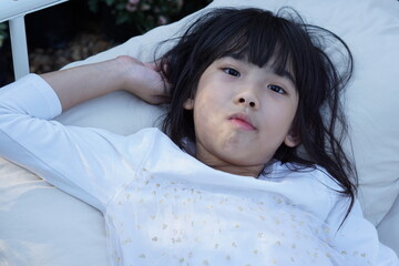 Portrait Asian Thailand kids cute little girl In white dress	