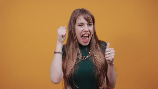 Excited young celebrating win, showing yes gesture, rejoicing success, reading good news, online lottery victory. Overjoyed crazy casual victorious event expressing emotions face isolated background