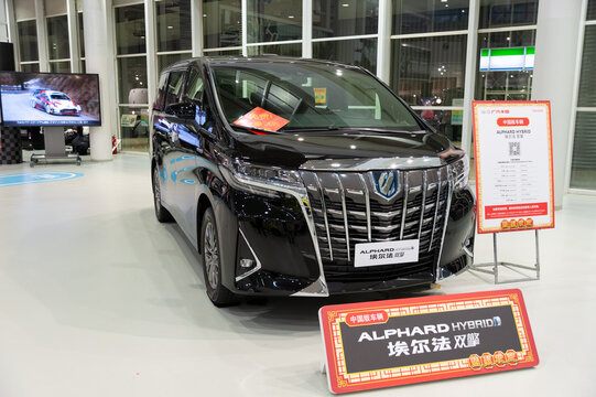 Odaiba, Tokyo, Japan - January 2, 2020: The luxury black Toyota Alphard Hybrid car. Front view. Toyota City Showcase Mega Web Palette Town.
