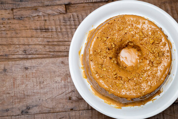 Nut cake in top view. On wooden table.