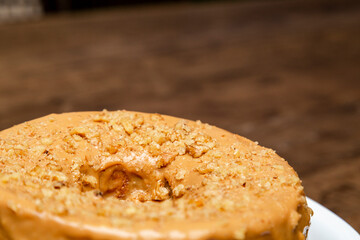 Walnut cake, on the left side of the photo, seen from above.