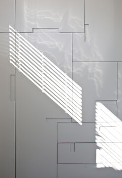 Sunlight pattern on grey wall 