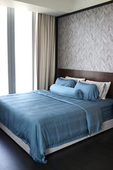 Closeup of pillows and bolster on a modern bed