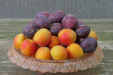 Fruit From Regional Cultivation In A Fruit Bowl, Apricots And Plums