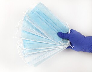 Hand on blue surgical gloves hanging Disposable masks