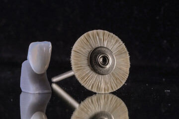 Isolated dental tools with a dental crown.
