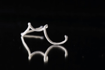 Isolated dental tools with a dental crown.