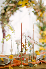 table setting for autumn wedding with candles