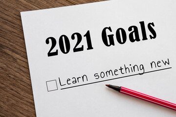 planner of goals and plans for 2021, a sheet of paper with the inscription emigrate to Asia from to do list