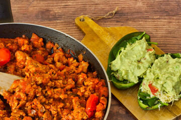 A tasty lunch avocado appetizer and spicy chicken