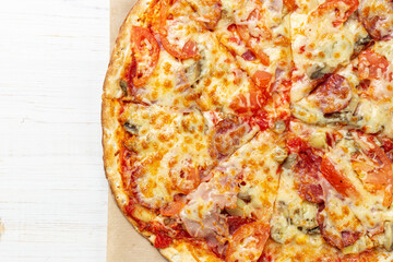 Delicious pizza on white wooden table. Pizza delivery. Pizza menu. Space for text.