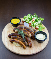 German Sausage and Vegetable Salad on a Wooden Tray