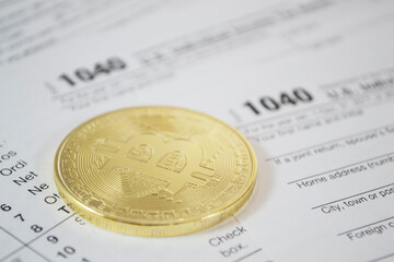 Close Up Shoot Of Golden and silver Bitcoin, ripple, ethereum and alternate cryptocurrencies on tax form, Selective Focused. Blockchain, Electronic Money And Finance Concept.
