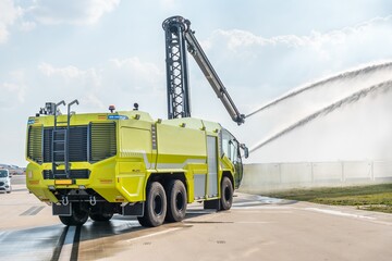 Yellow fire truck on the airport runway
