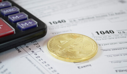 Bitcoin pile and alternate cryptocurrencies coin and calculator laying on 1040 tax form and dollar bills. Fees and taxes for cryptocurrencies investments concept.