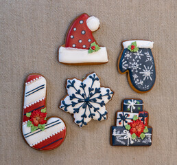 Christmas gingerbread cookies on a linen tablecloth.