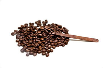 Coffee beans in wooden spoon. White background.