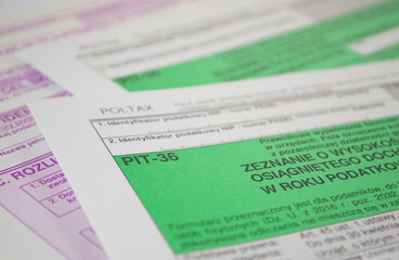 Close up of Polish income tax forms on desk. Accountant performs tax settlements