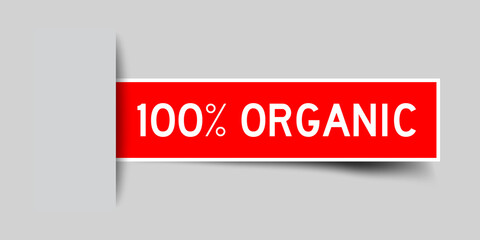 Inserted red color label sticker with word 100 percent organic on gray background