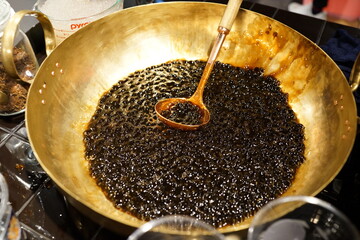 Close up of brown sugar tapioca ball also known as boba in bubble tea. It is an ingredient for making Taiwanese pearl milk tea.