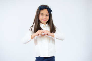 Photo of adorable sweet little girl make hands heart figure isolated on white background