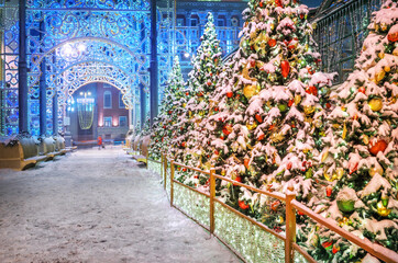 Christmas trees with toys under the snow near the building of the mayor's office in Moscow