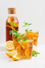Iced tea with lemon slices, mint and ice