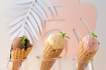 Waffle cones with strawberry, vanilla, chocolate ice cream