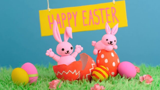 Cute pink Easter rabbits and colorful eggs