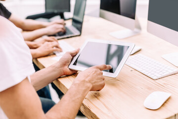 close up. the employee uses a digital tablet in the workplac