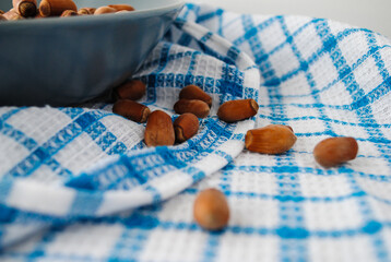 Ripe hazelnuts in a jar on the table.