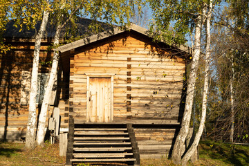 Natural landscape with wooden building.