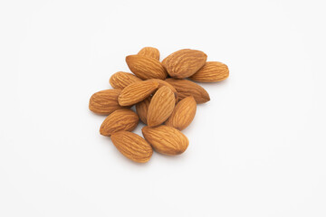 pile of almonds on white background isolated
