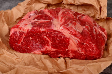 Raw beef ribeye steak on a baking paper. beef steak antrecot