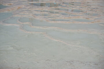 White travertine terrace formations and pools in Pamukkale, Turkey