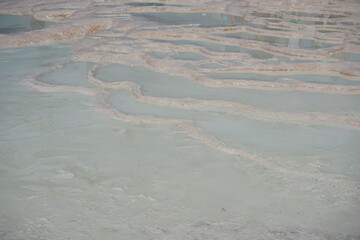 White travertine terrace formations and pools in Pamukkale, Turkey