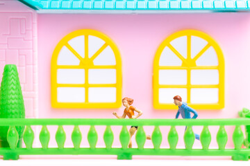 Miniature people , Couple running near their house together , Healthy lifestyle concept
