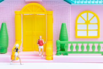 Miniature people , Couple running near their house together , Healthy lifestyle concept